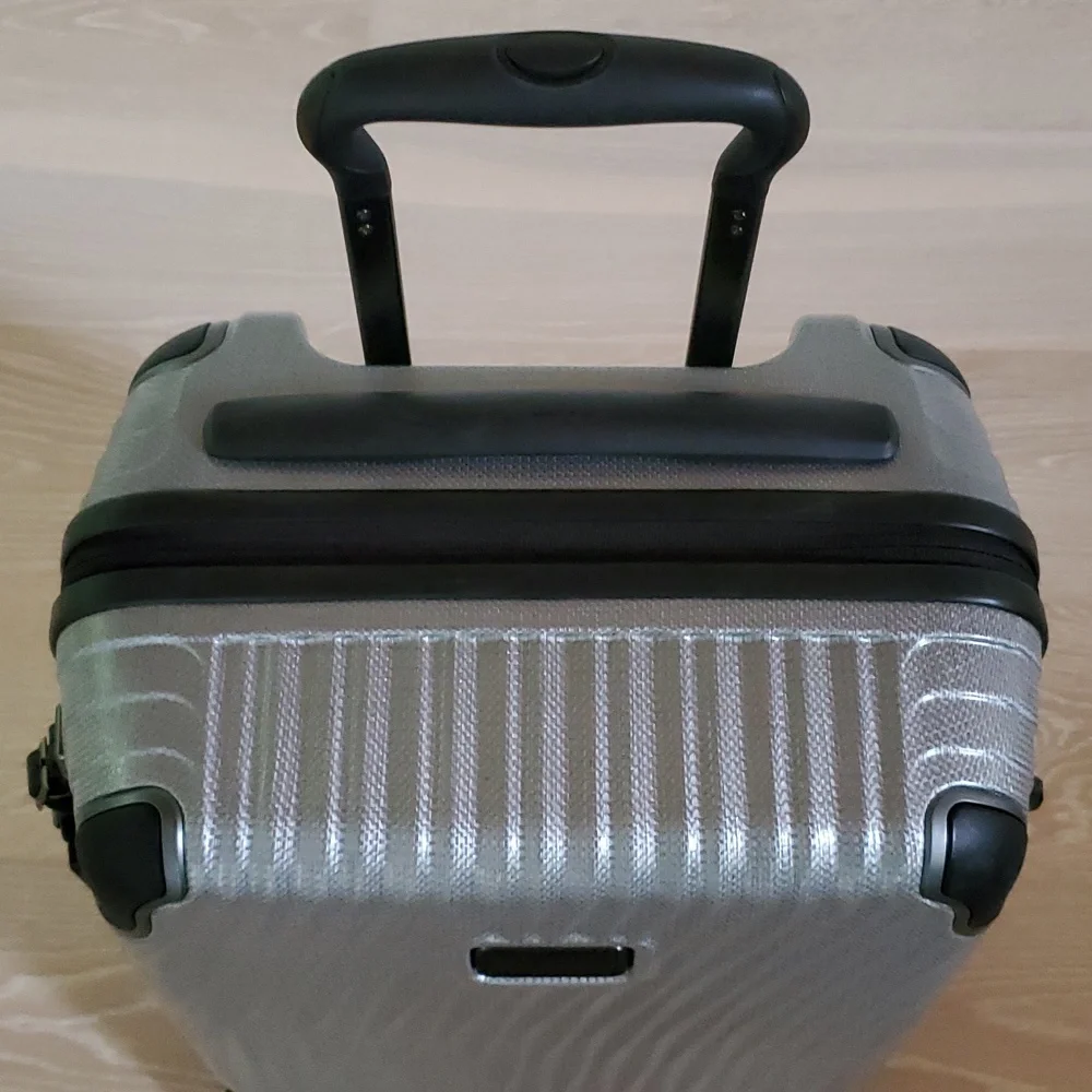 NWOT Tumi Latitude International Carry-On Spinner Luggage in Silver
